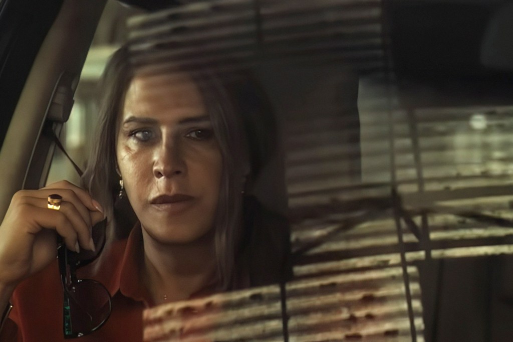 Karla Sofía Gascón in a red shirt.