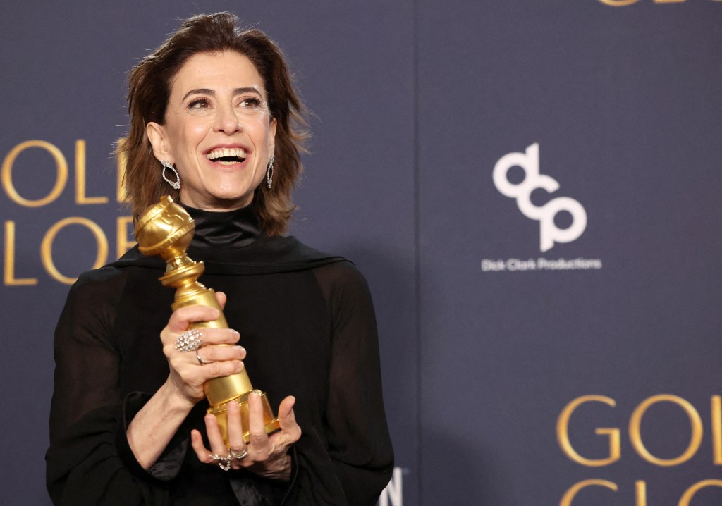 Fernanda Torres in a black gown.