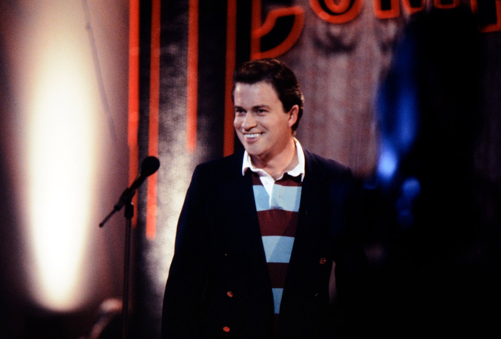  Harry Enfield performing as "Tim Nice But Dim" in 1995. 