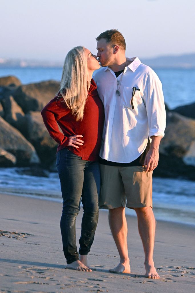 Heidi Montag and Spencer Pratt kiss on the beach.