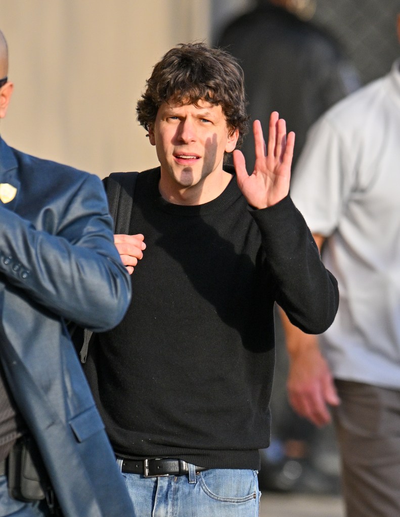 Jesse Eisenberg waves to the cameras while arriving at "Jimmy Kimmel Live!" in Los Angeles.
