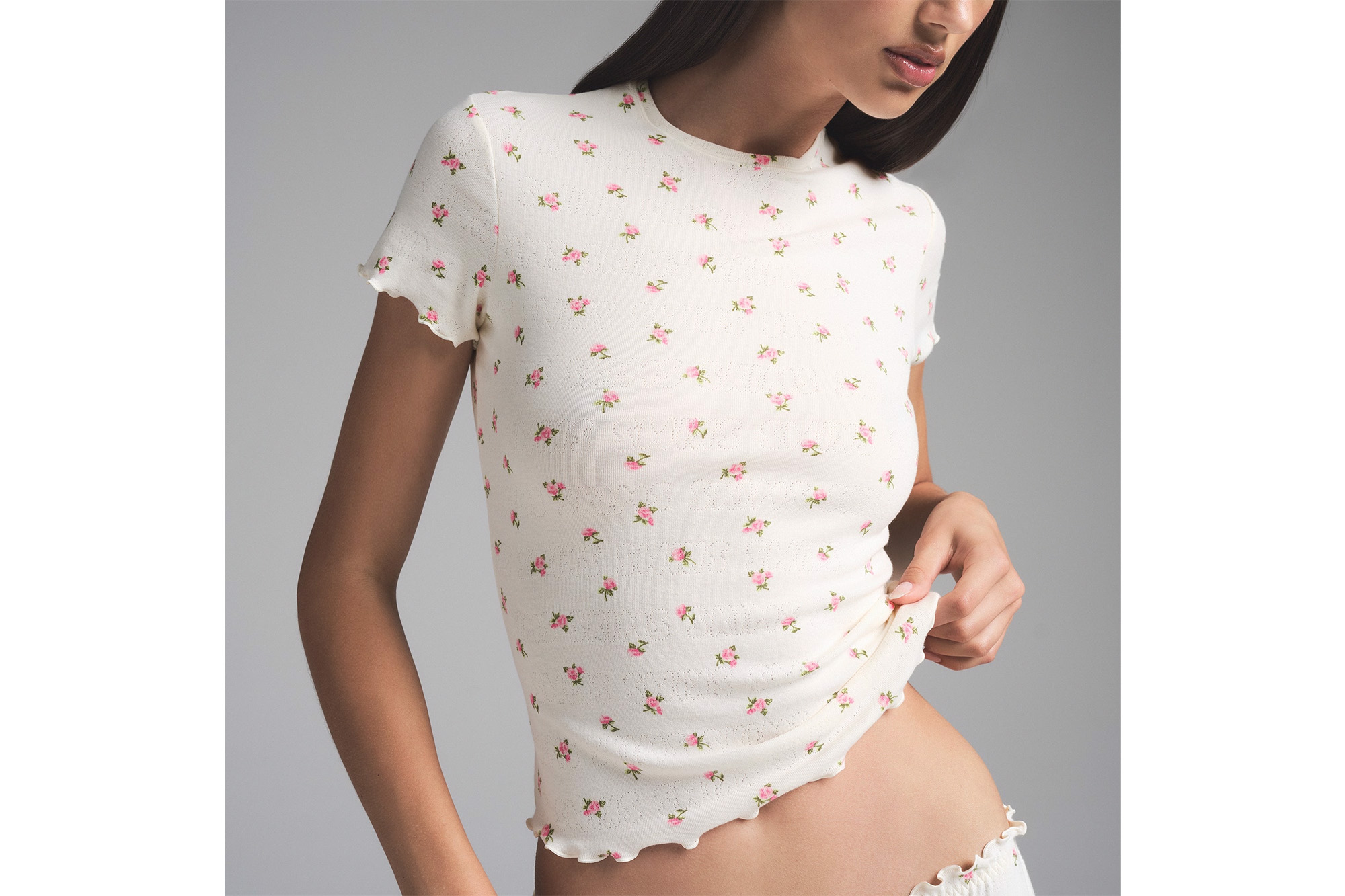 A model in a floral T-shirt